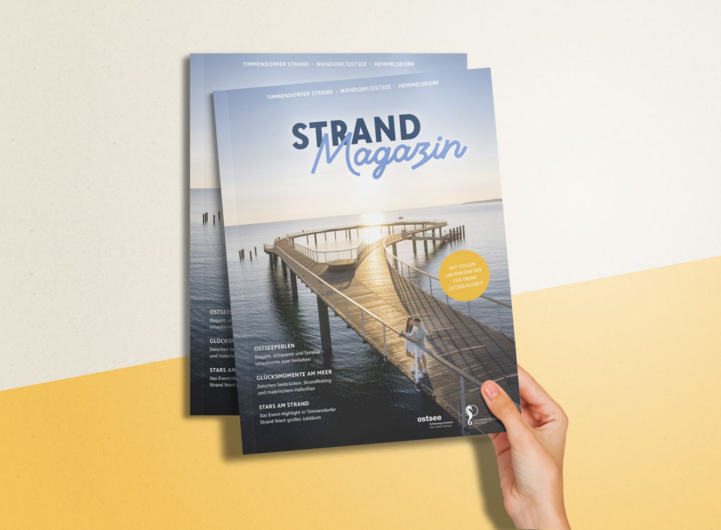 Die Titelseite des Strandmagazins auf einem gelben Hintergrund.
